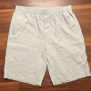 Men’s grey Casei running shorts. Side zipper pockets.  Size XL New with tag